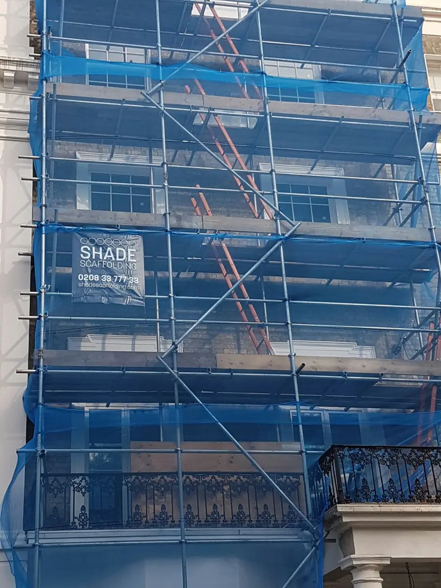Blue netting and a Shade Scaffolding banner